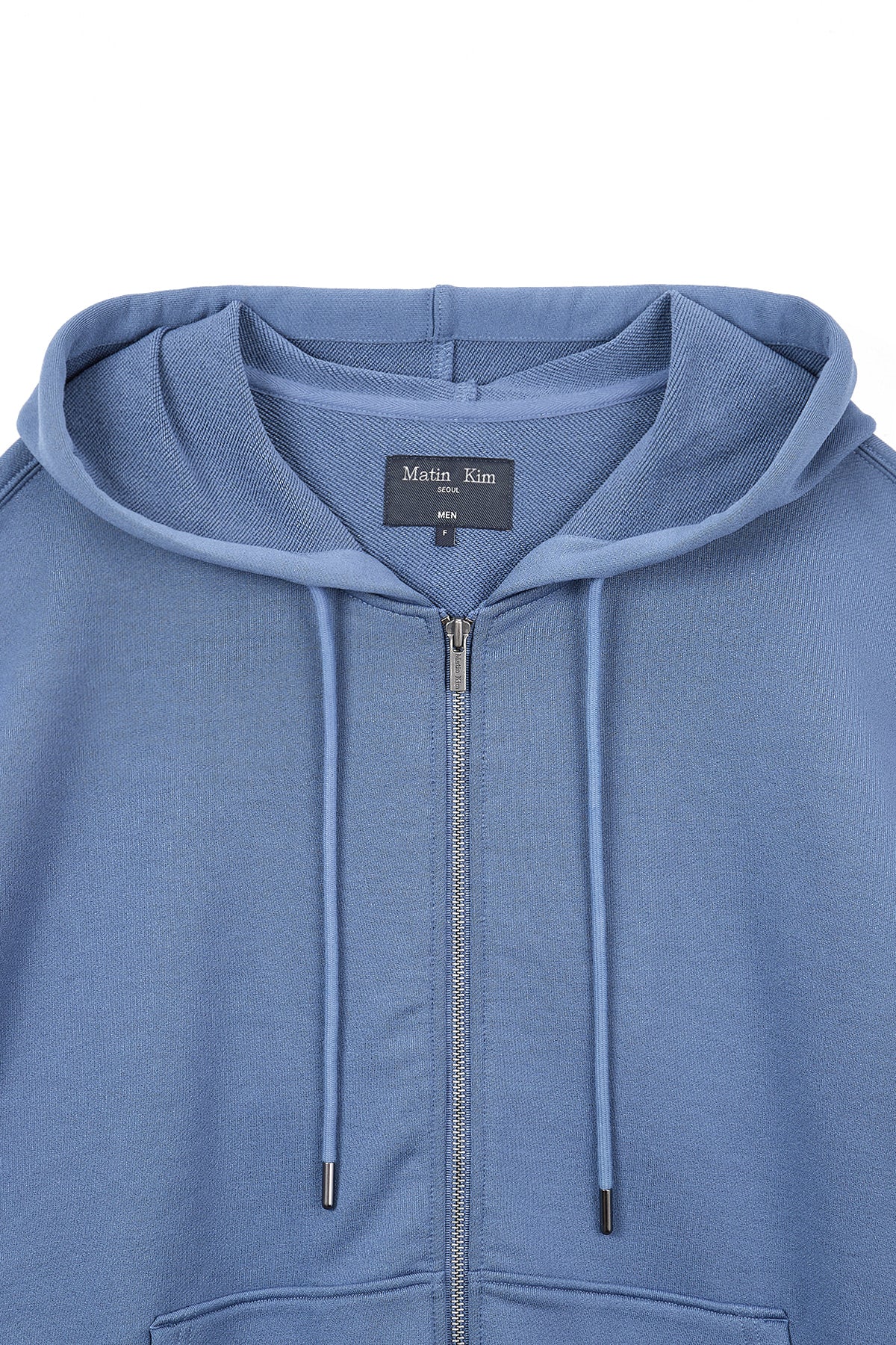 [matinkim] BACK LOGO GLITTER HOODY ZIP UP FOR MEN IN BLUE