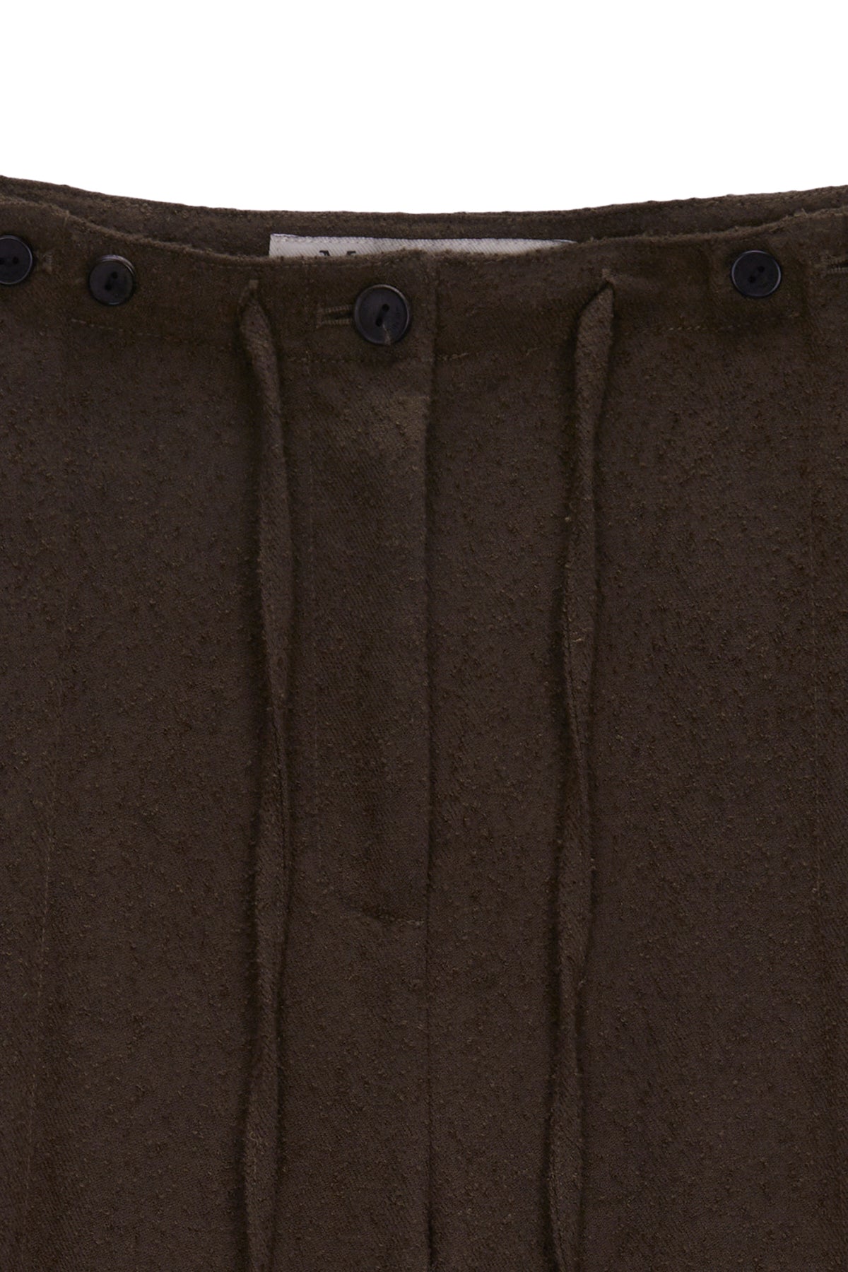 [matinkim] WAIST BUTTON POINT STRING SLIM PANTS IN BROWN