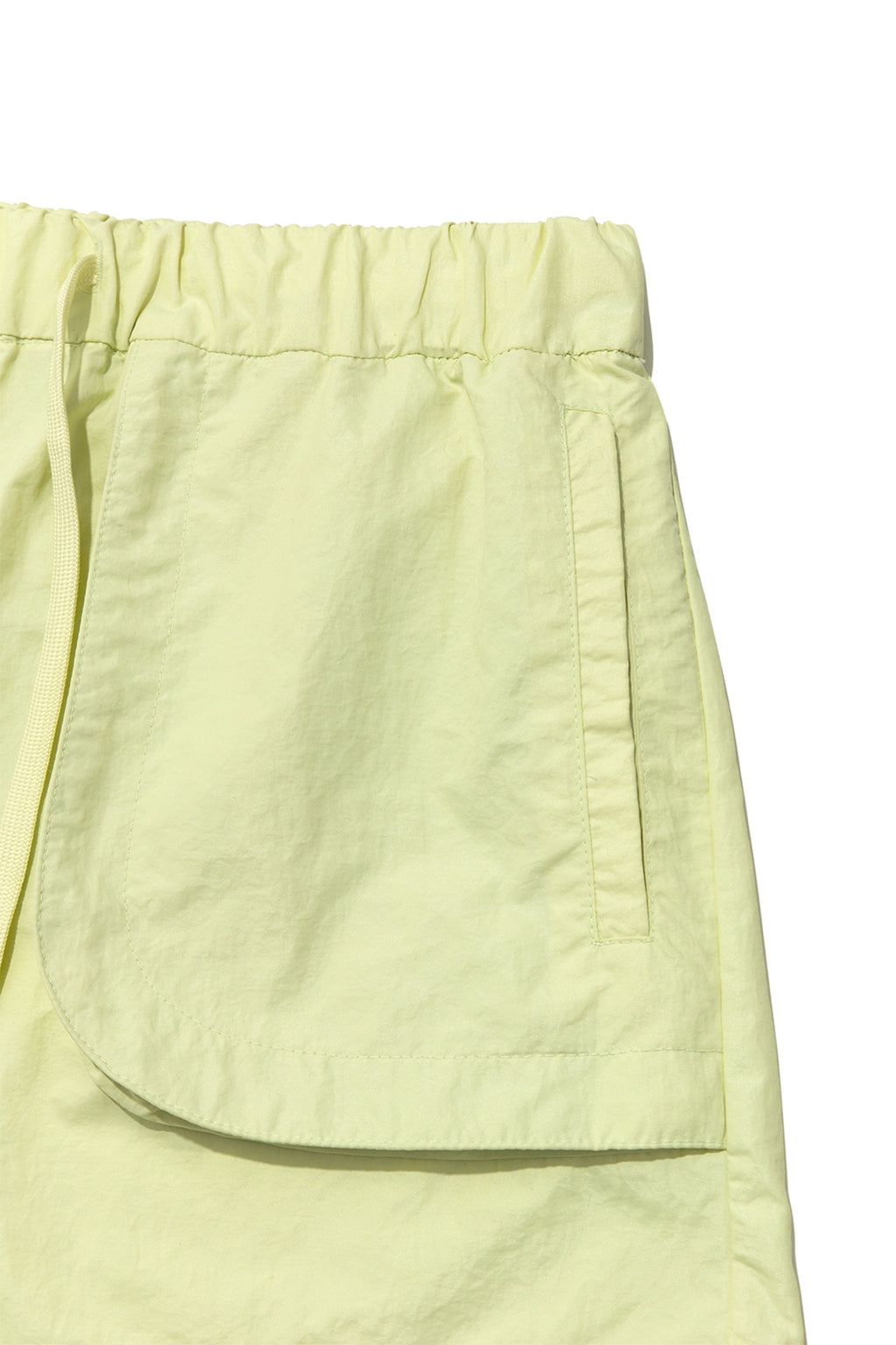 [matinkim] OUT POCKET NYLON BANDING SHORTS IN LIME