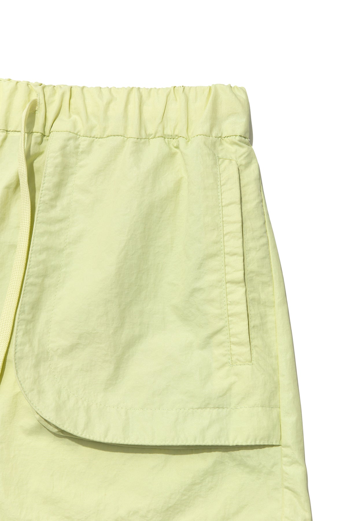 [matinkim] OUT POCKET NYLON BANDING SHORTS IN LIME
