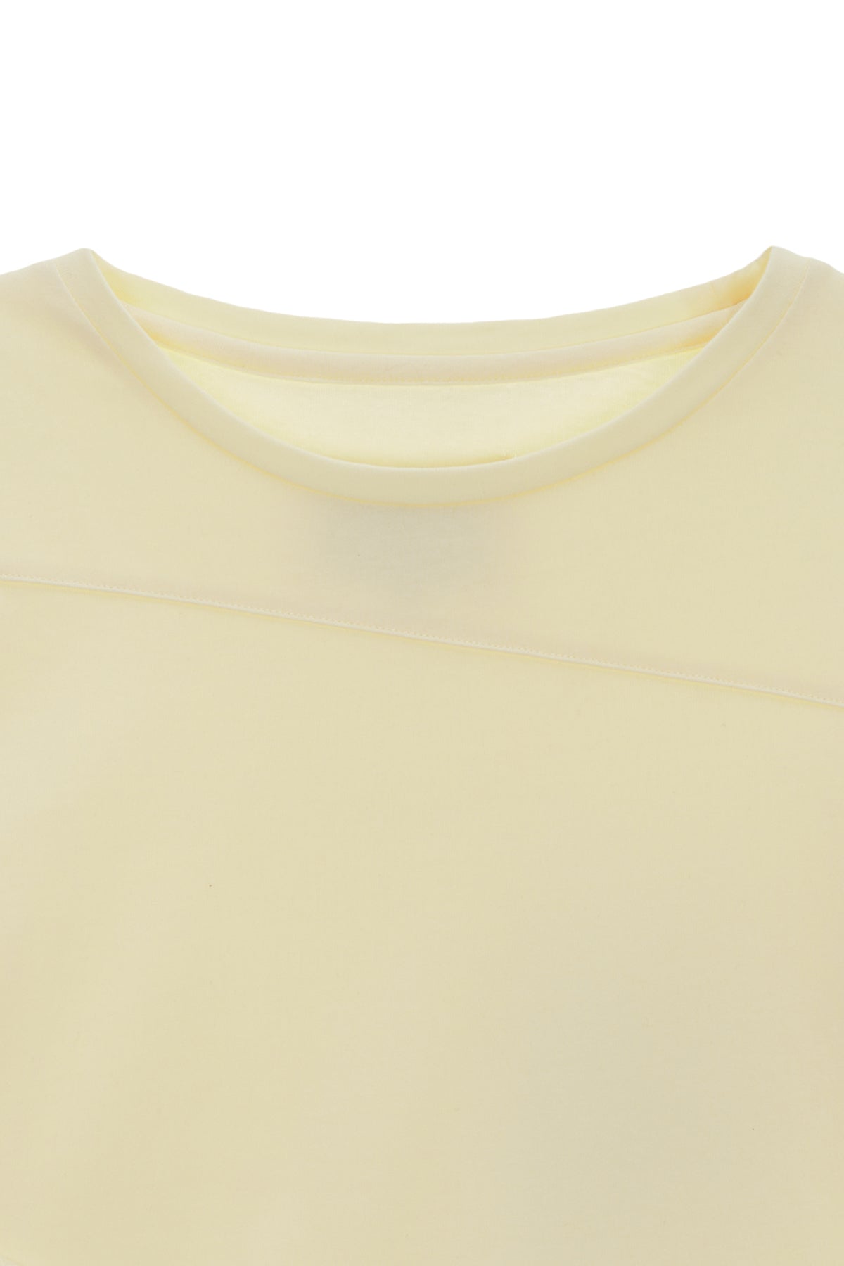 [matinkim] DIAGONAL SLIMFIT LONG SLEEVE TOP IN LIGHT YELLOW