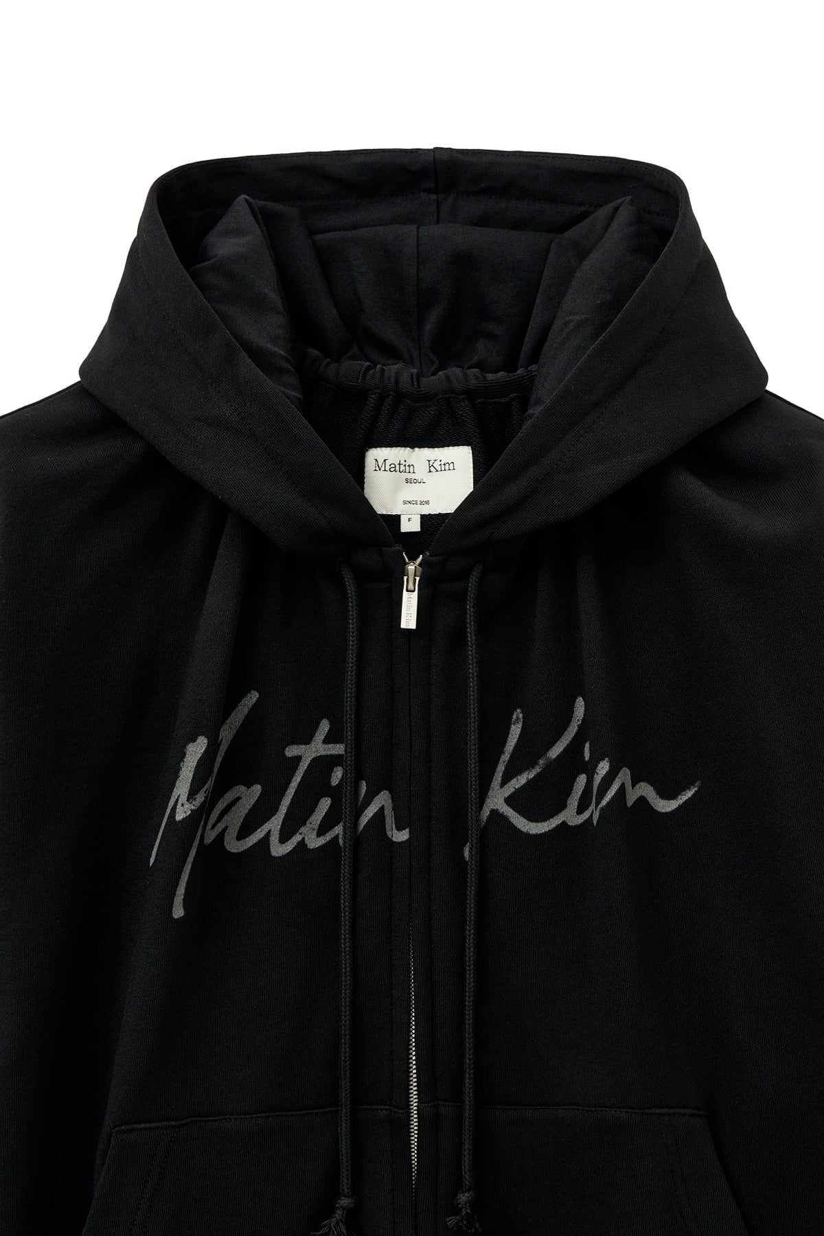 [matinkim] DRAWSTRING POINT ZIP UP HOODY IN BLACK