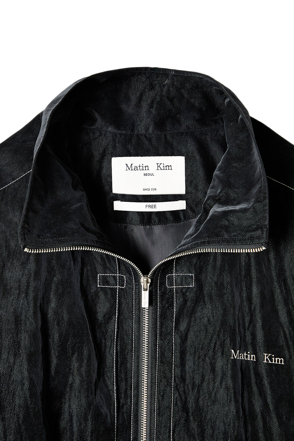 [matinkim] STITCH POINT HIGH NECK JUMPER IN BLACK