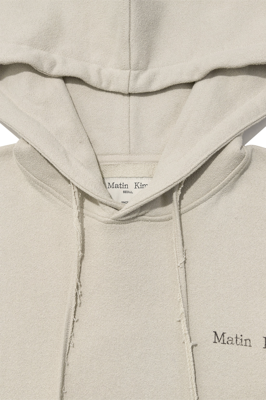 [matinkim] RIB CUT DETAIL LOGO HOODY IN BEIGE
