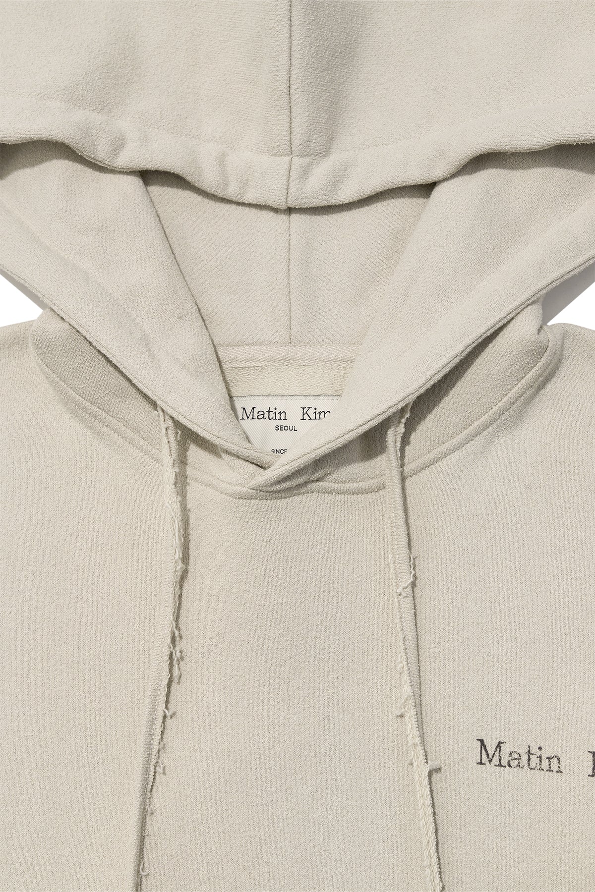 [matinkim] RIB CUT DETAIL LOGO HOODY IN BEIGE
