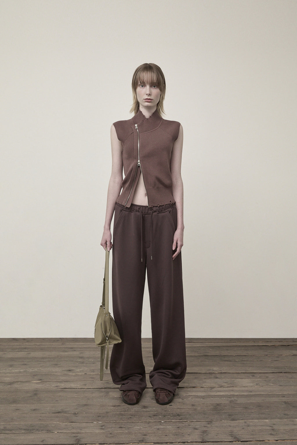 [matinkim] HIGH NECK LOGO KNIT ZIP UP VEST IN BROWN