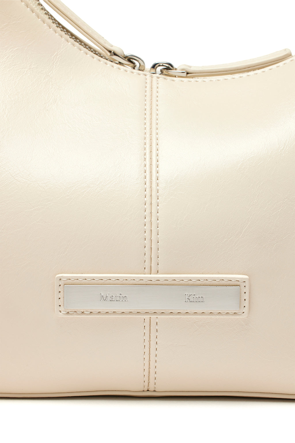 [matinkim] ASYMMETRICAL ZIPPER BAG IN IVORY