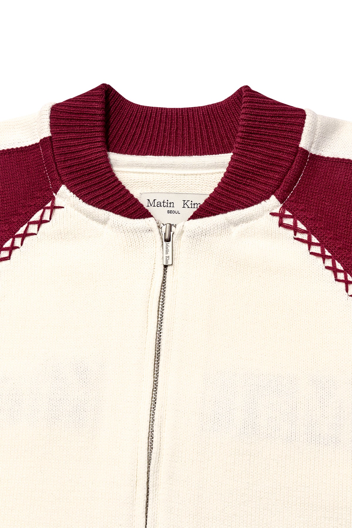 [matinkim] BACK LOGO RAGLAN KNIT ZIP UP IN IVORY