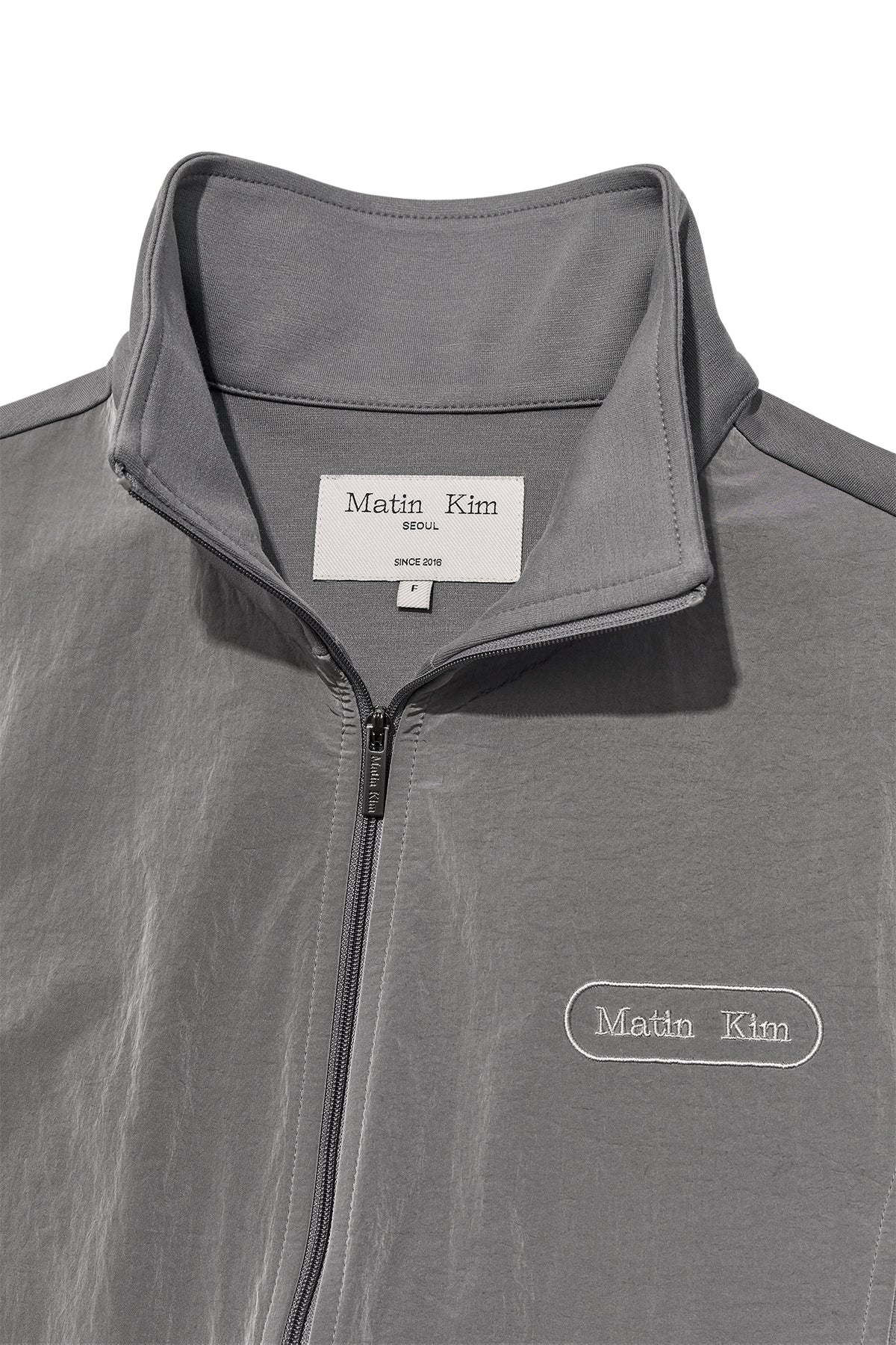 [matinkim] HIGH NECK WINDBREAKER ZIP UP FOR WOMEN IN GREY