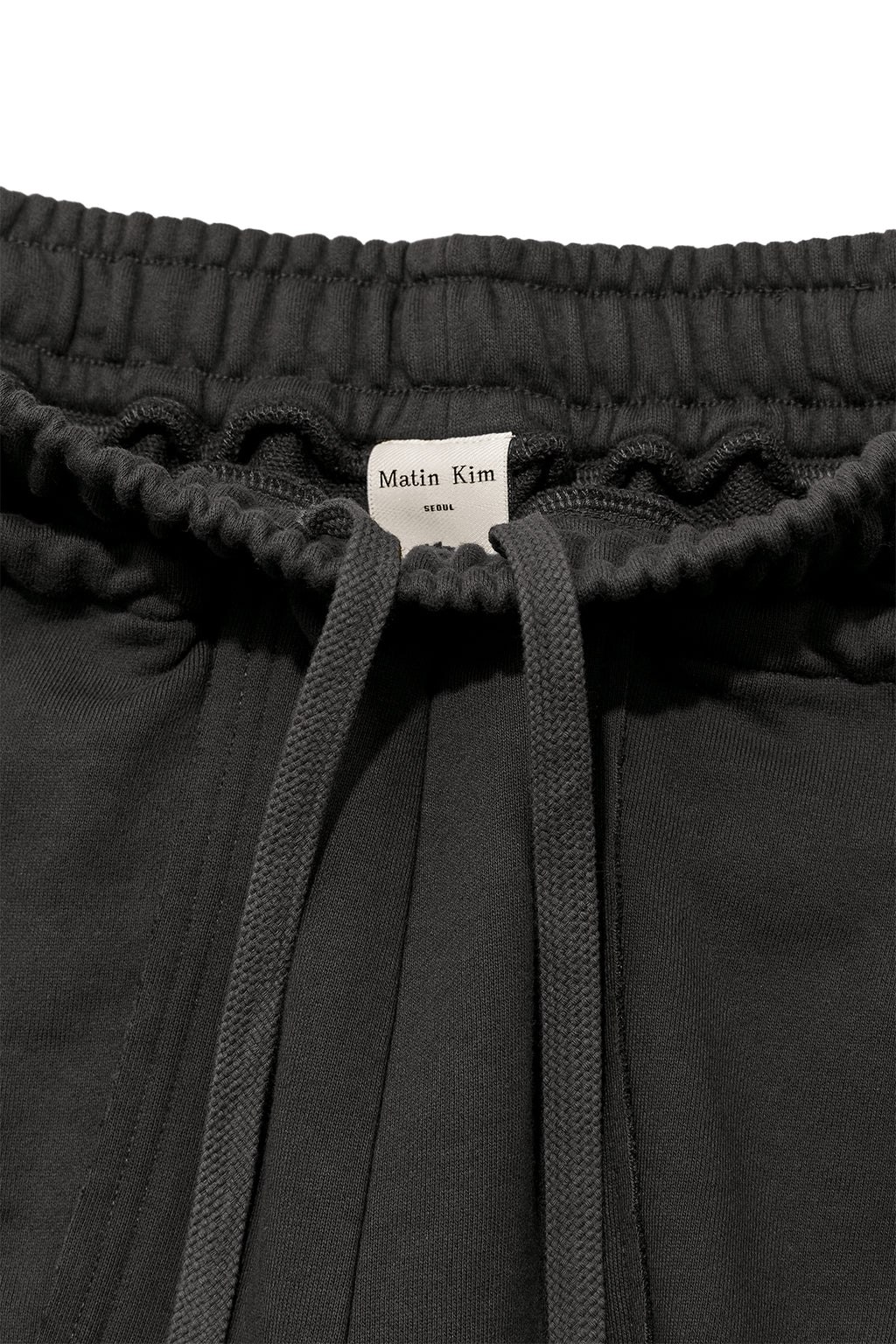 [matinkim] VOLUME POCKET SWEATPANTS IN CHARCOAL