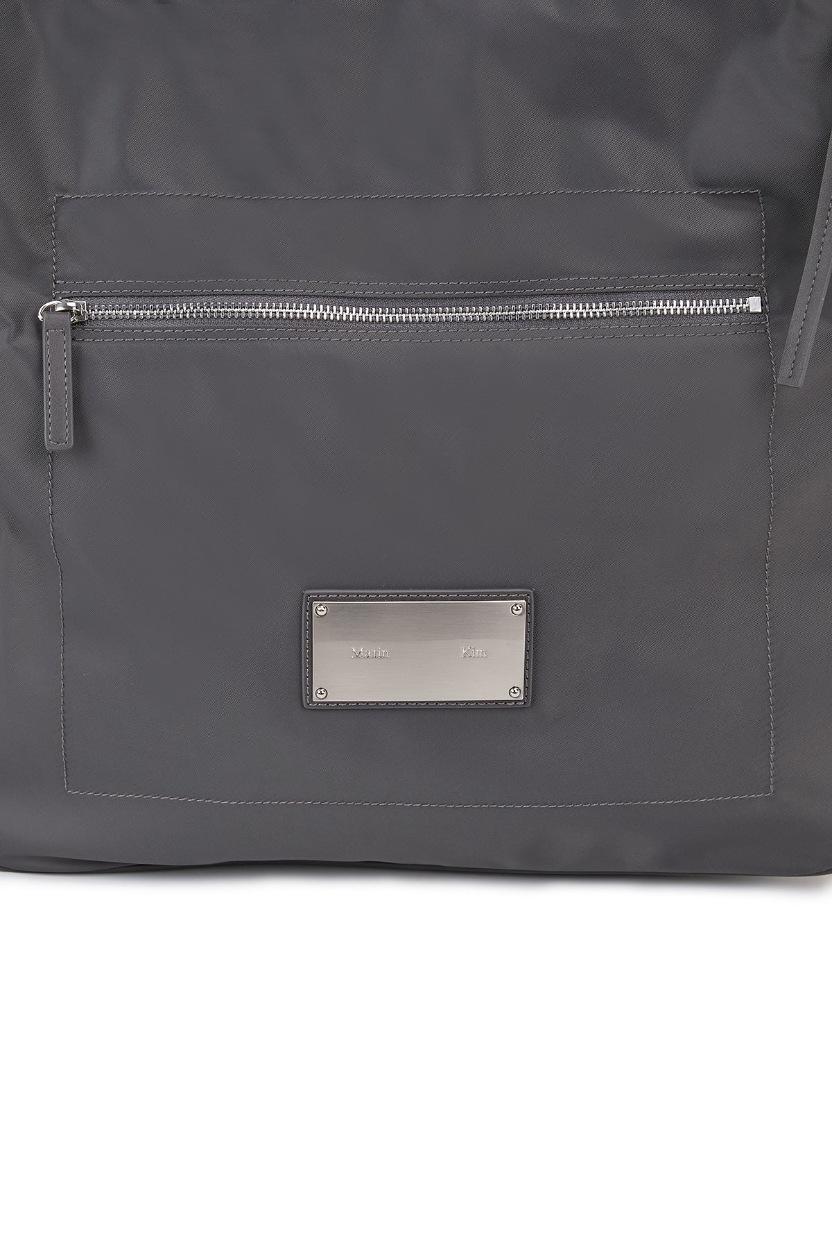 [matinkim] EMBOSSED LOGO FABRIC SHOULDER BAG IN CHARCOAL