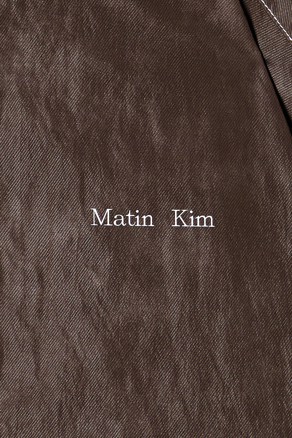 [matinkim] STITCH POINT HIGH NECK JUMPER IN BROWN