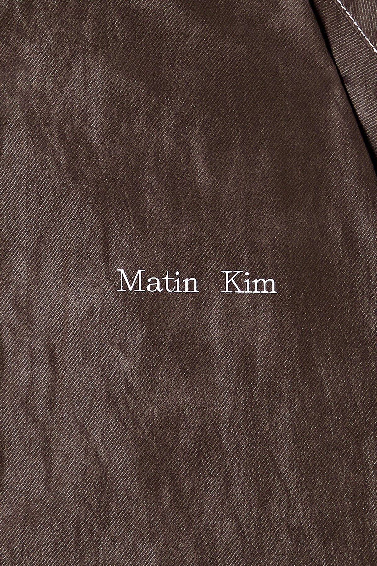 [matinkim] STITCH POINT HIGH NECK JUMPER IN BROWN