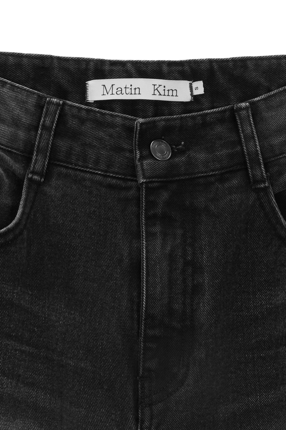 [matinkim] HEM WASHED POINT DENIM PANTS IN BLACK