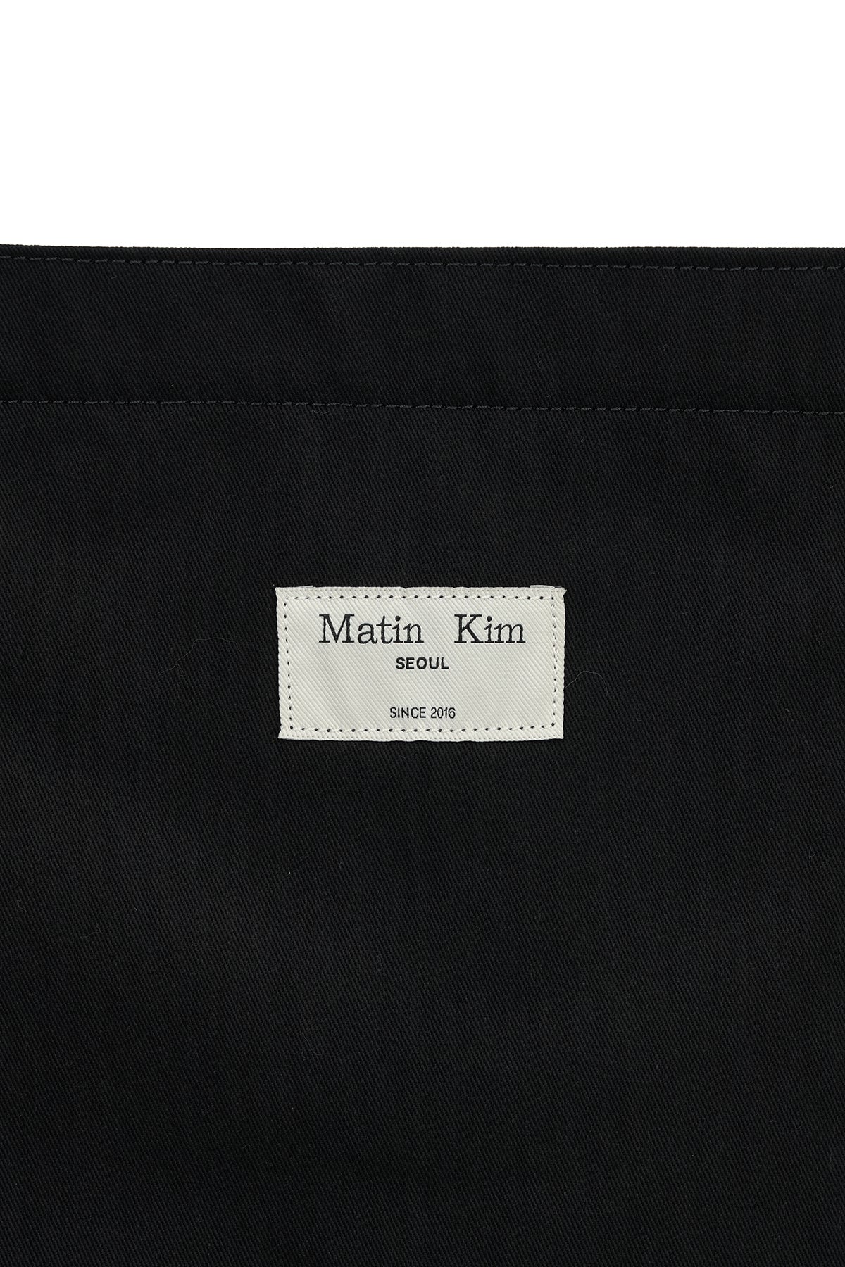 MATIN LNY 26 ECO BAG in Black by Matin Kim, a stylish and functional designer handbag.