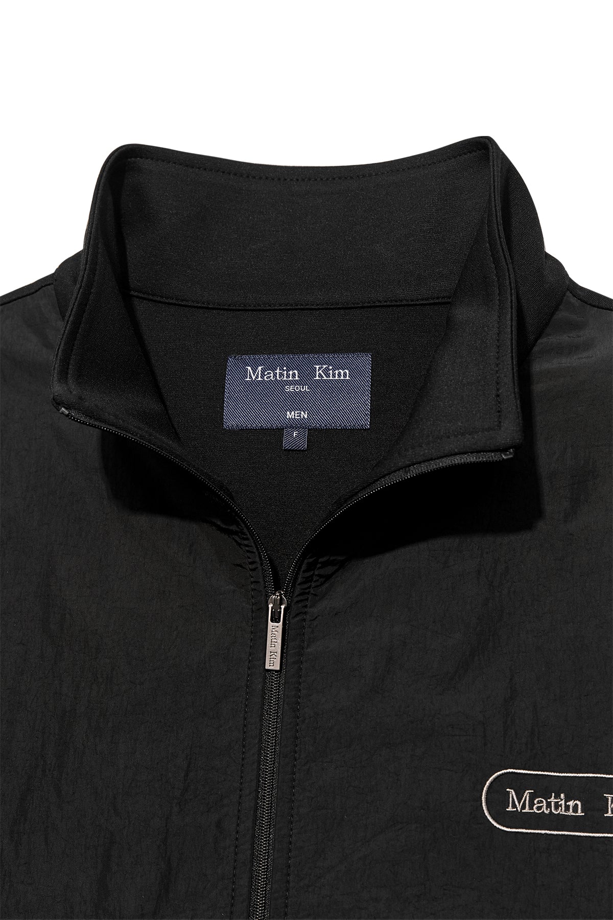 [matinkim] HIGH NECK WINDBREAKER ZIP UP FOR MEN IN BLACK