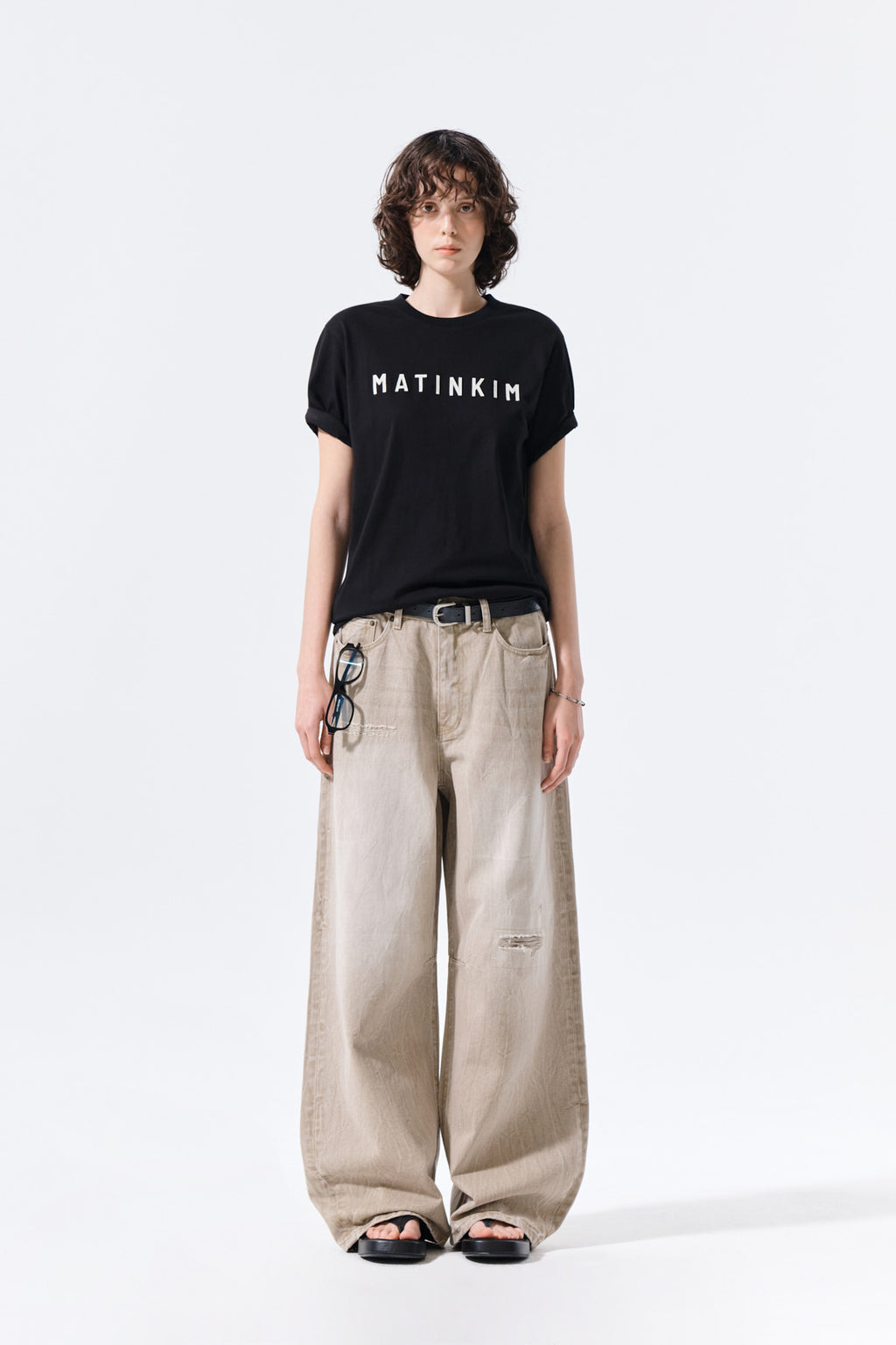 Matinkim Back Logo Washed Denim Pants IN Beige