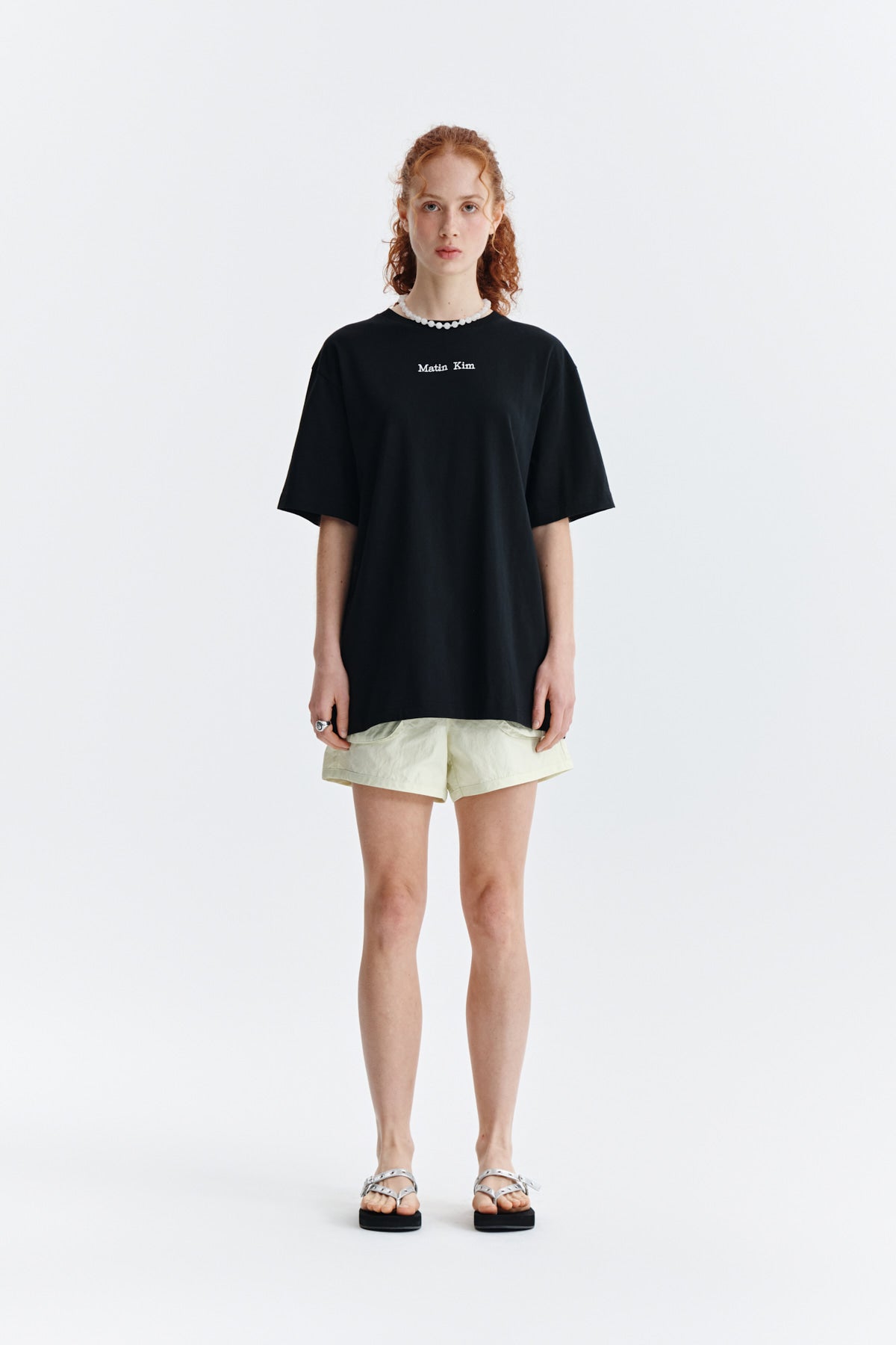 [matinkim] EMBROIDERY SMALL LOGO OVERSIZE TOP IN BLACK