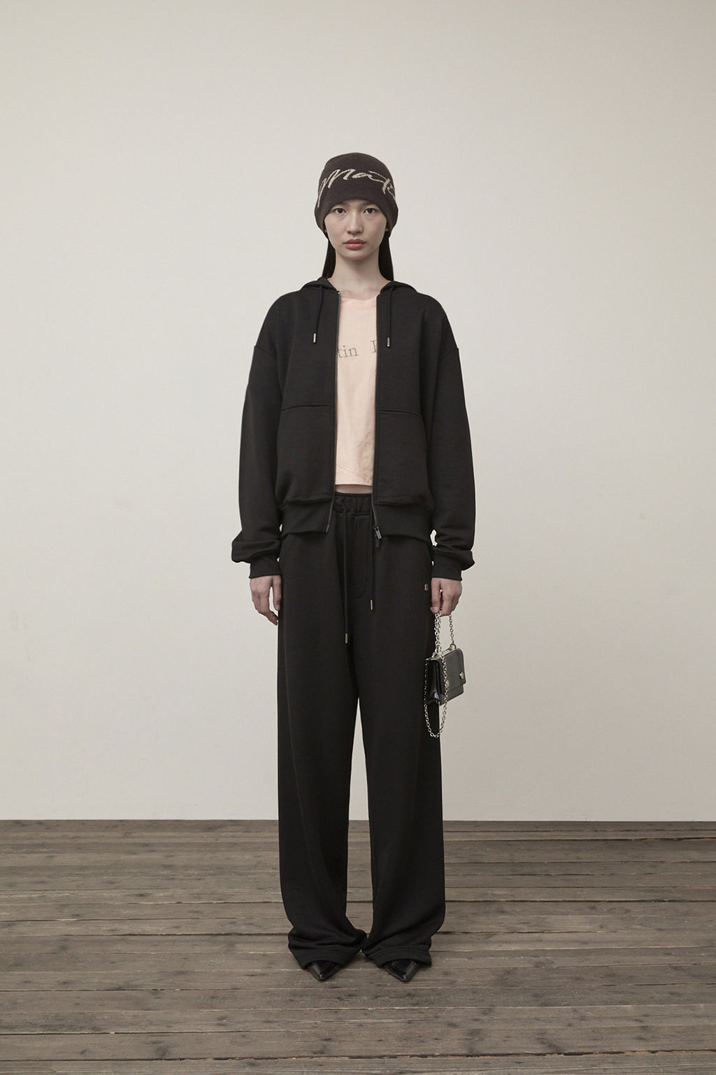 [matinkim] BACK LOGO GLITTER HOODY ZIP UP FOR WOMEN IN BLACK