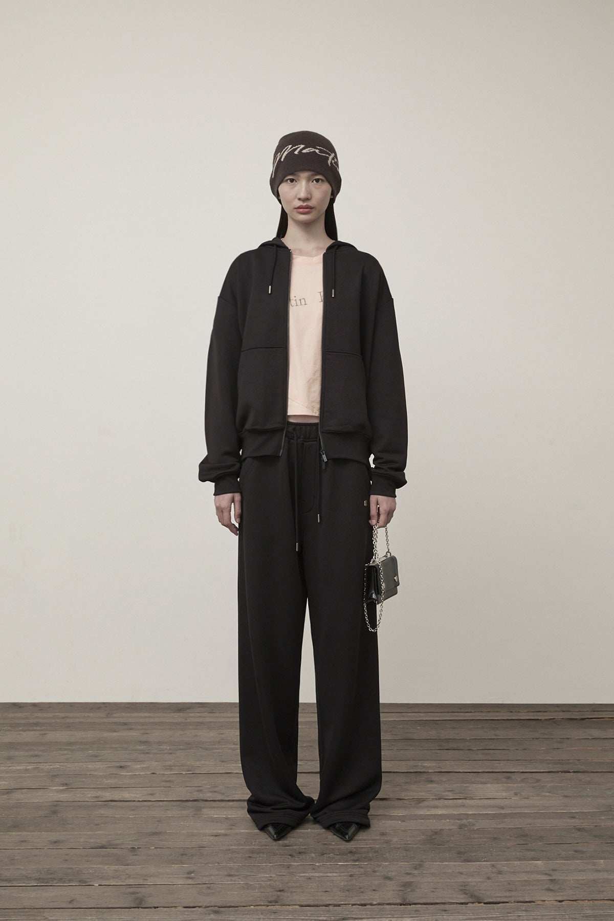 [matinkim] BACK LOGO GLITTER HOODY ZIP UP FOR WOMEN IN BLACK