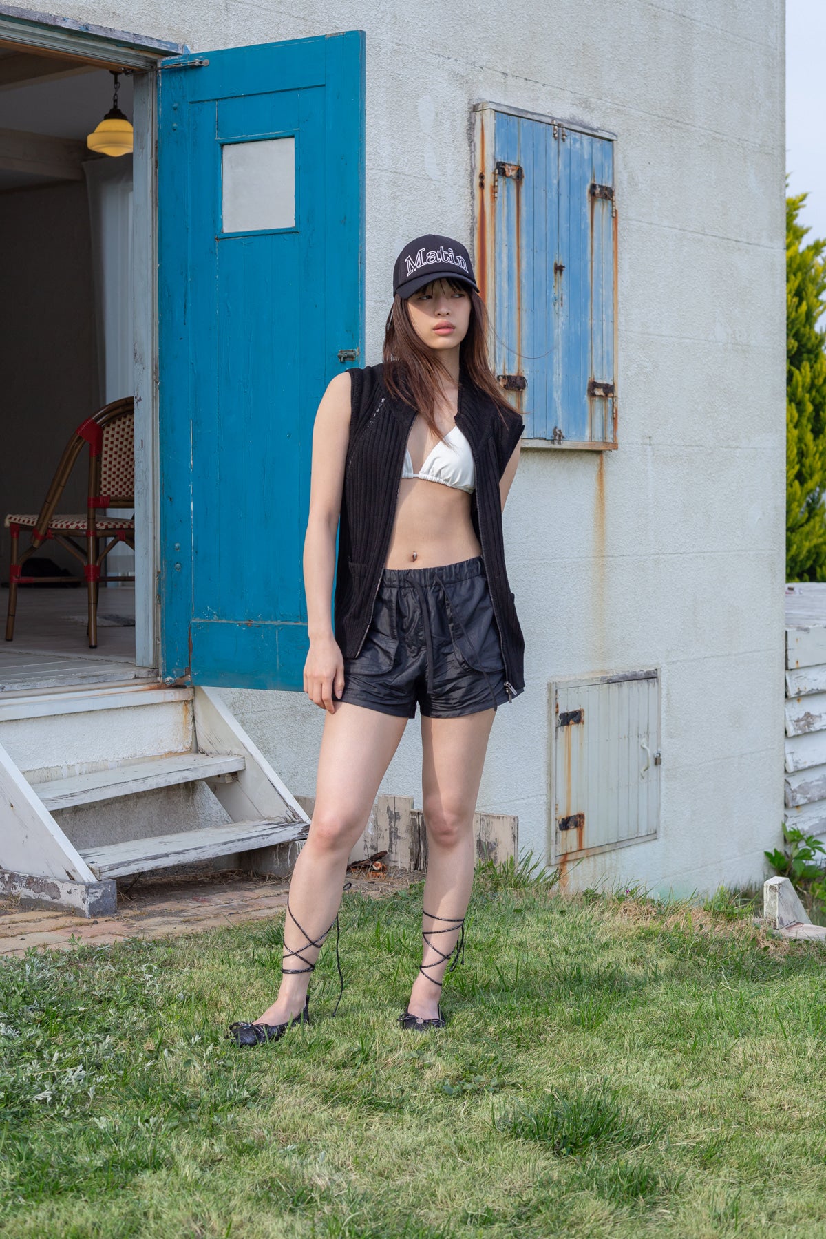 [matinkim] BACK LOGO HIGH NECK KNIT VEST IN BLACK