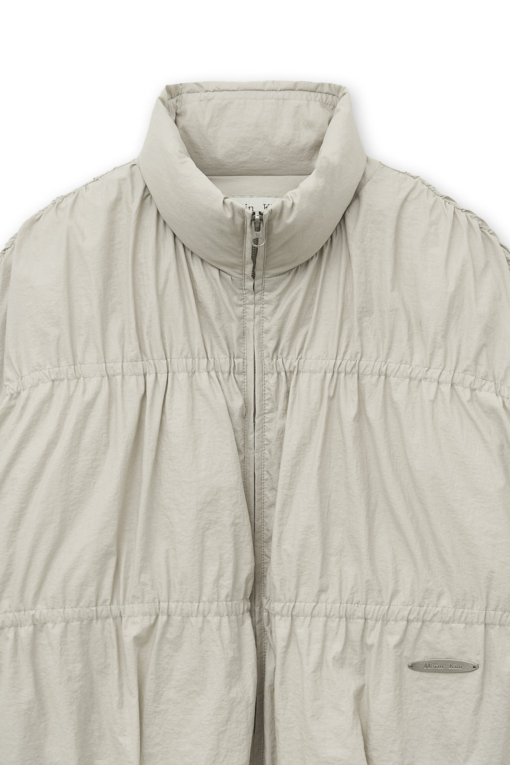 [matinkim] HIGH NECK SHIRRING DOWN JUMPER IN LIGHT BEIGE