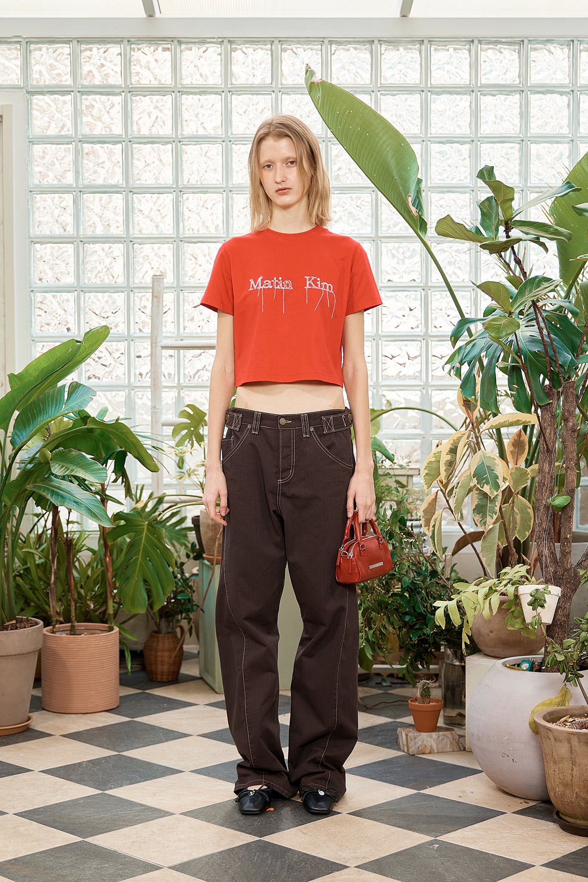 [matinkim] WAIST BUCKLE CURVED TWILL DENIM PANTS IN CHARCOAL