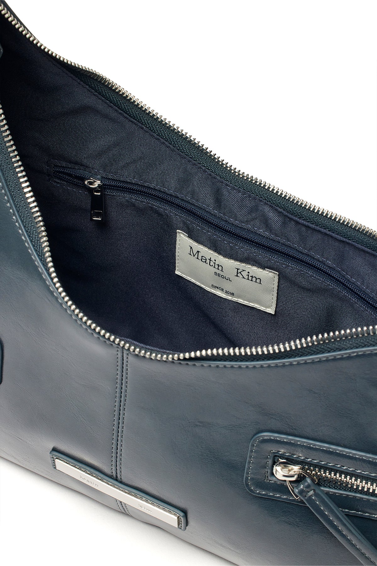 [matinkim] ASYMMETRICAL ZIPPER BAG IN CHARCOAL