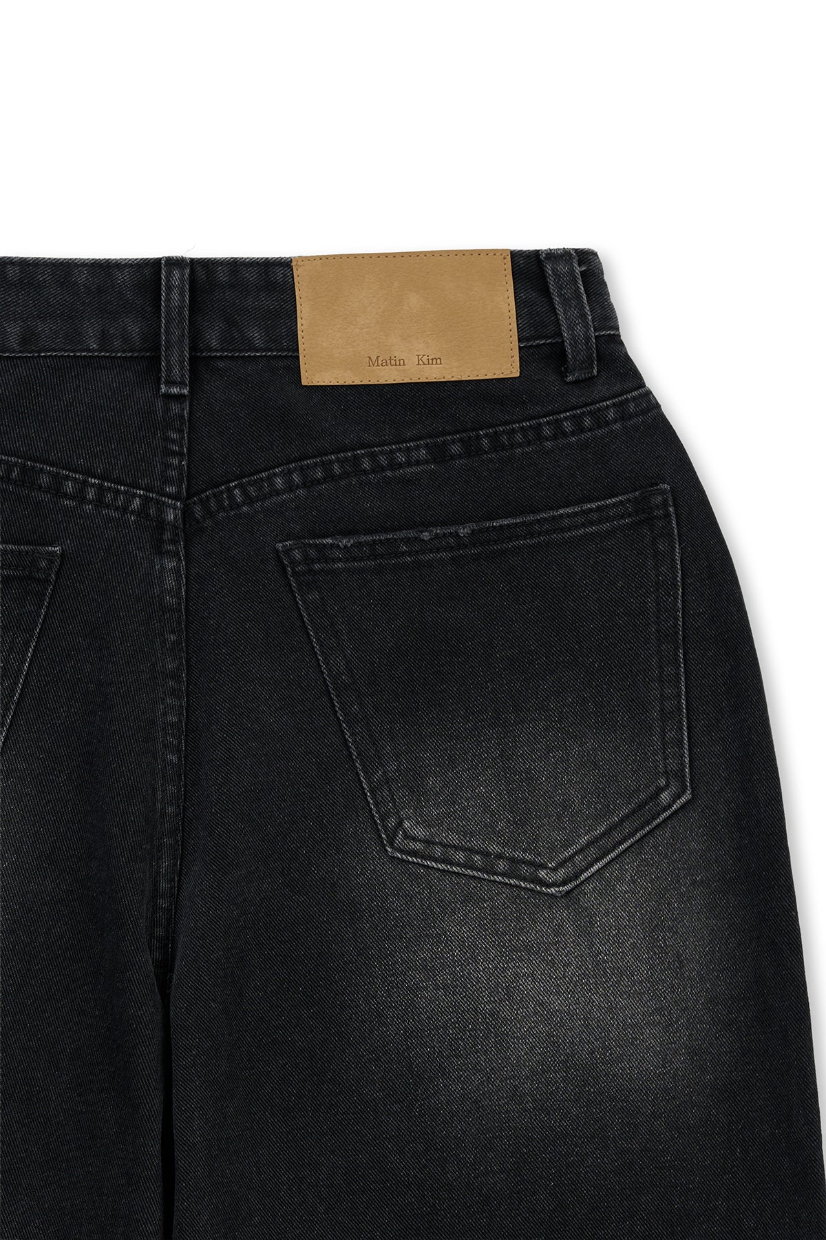 [matinkim] FRONT LAYERED DISTRESSED DENIM PANTS IN BLACK