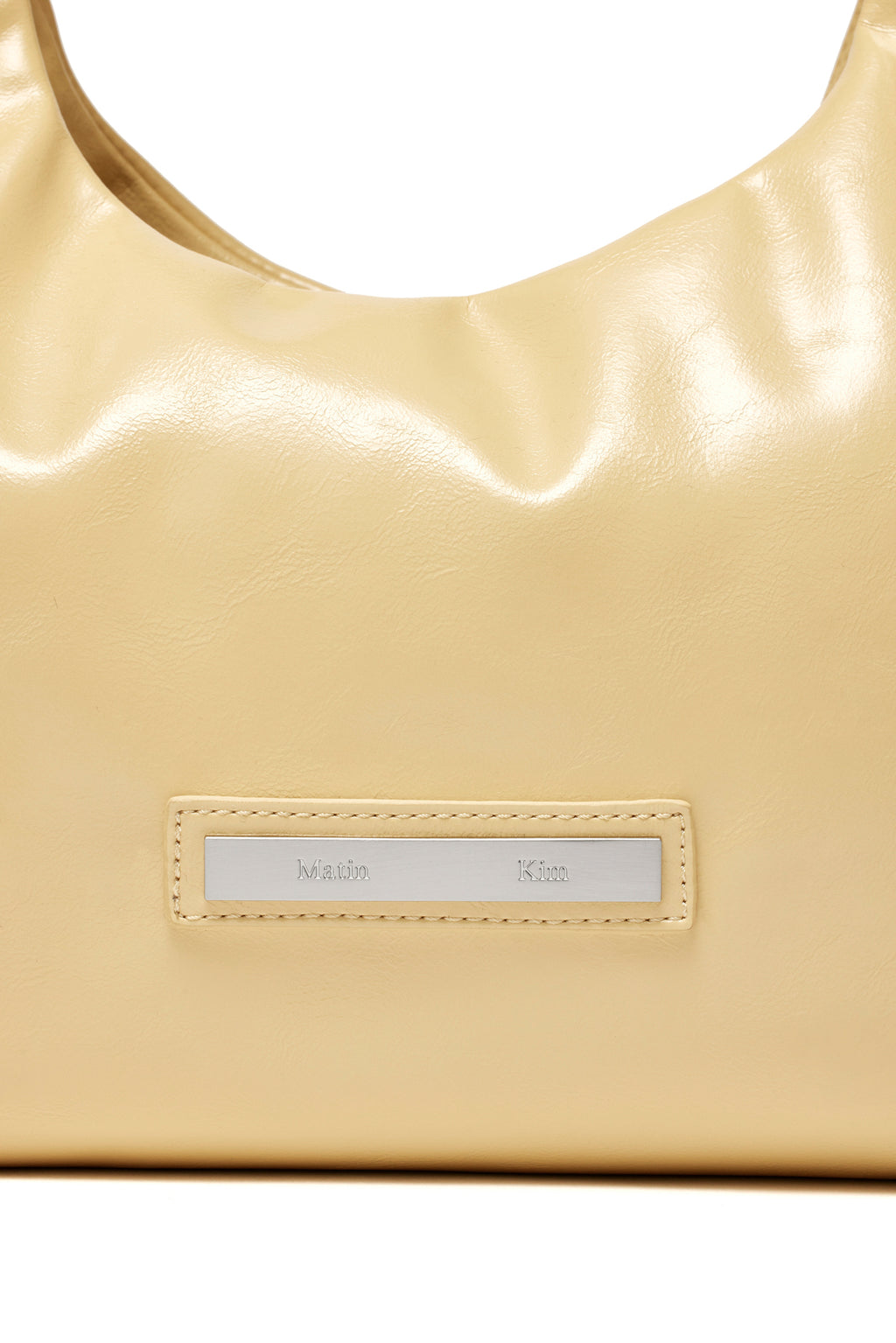 [matinkim] EMBOSSED LOGO LEATHER MINI TOTE BAG IN LIGHT YELLOW