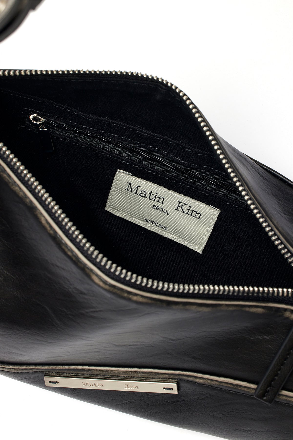 [matinkim] DIRTY WASHED DIAGONAL BAG IN BLACK