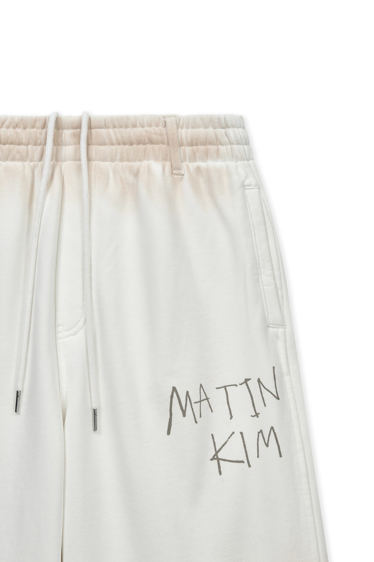 [matinkim] VINTAGE WASHED LOGO SWEATPANTS IN IVORY