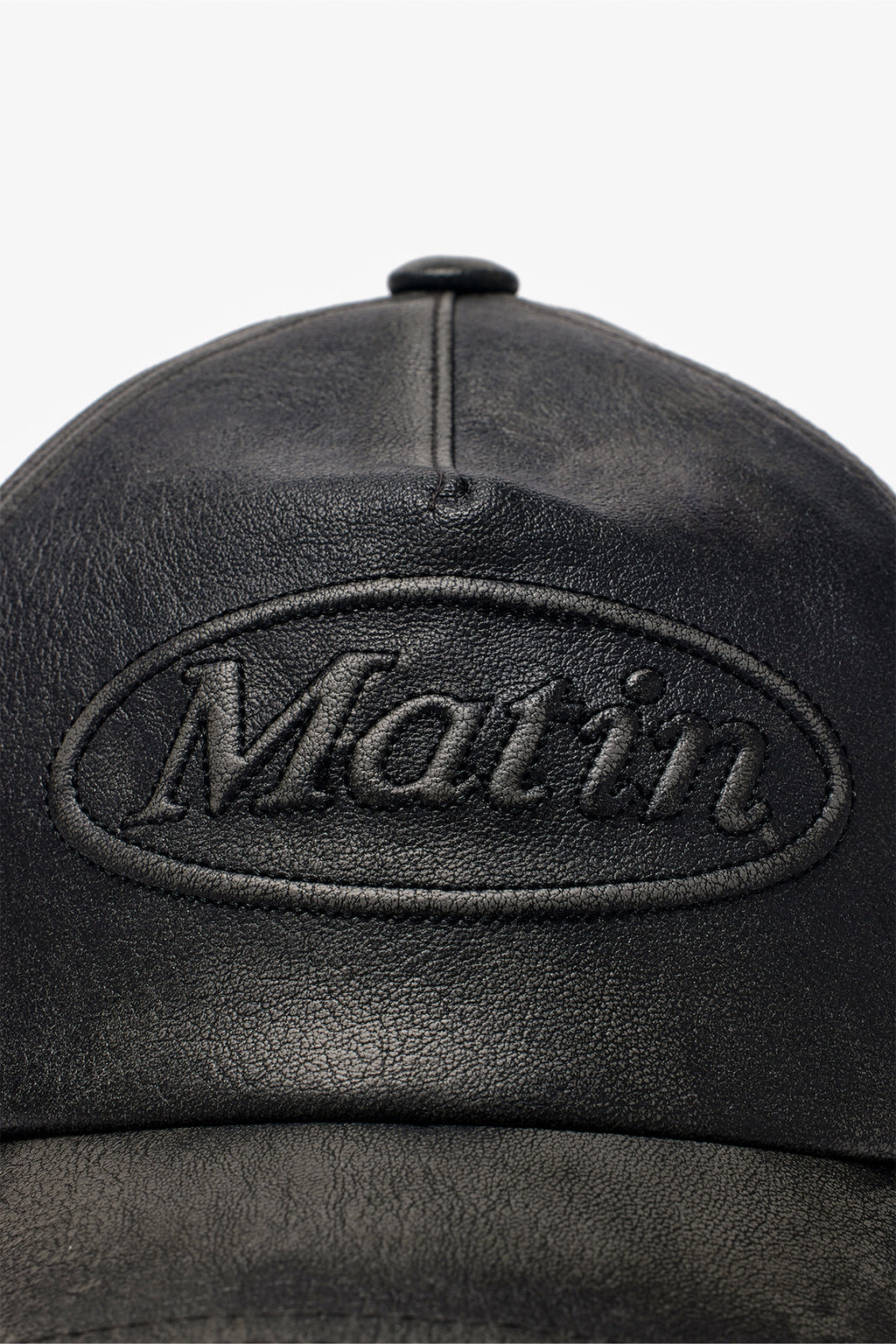 [matinkim] EMBOSSED LOGO LEATHER BALL CAP IN BLACK